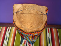 Mexican vintage folk art and beadwork, a wooden-carved mask representing a jaguar, Huichol, c. 1970's. Photo of the back of the mask.