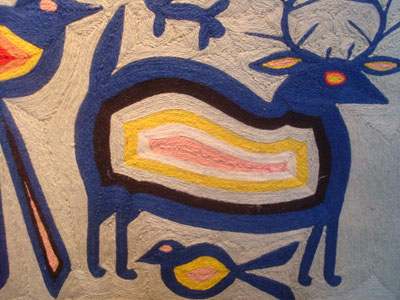 Mexican vintage folk art, a Huichol yarn paintaing, c. 1950. Closeup photo of the front of the painting.