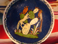 Mexican vintage pottery and ceramics, and Mexican vintage folk art, a pottery plate from Tlaquepaque, Jalisco, with a wonderful scene of a fox and beautiful bird (a quetzal), on a dark blue slip, c. 1930-40. Another photo of the center of the plate.