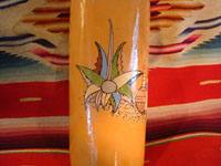 Mexican vintage pottery and ceramics, and Mexican vintage folk art, a pottery bottle from Tlaquepaque, Jalisco, c. 1930. The bottle has a lovely cream-colored background, with a wonderful scene of a snoozing Mexican campesino with his burro amidst wonderful trees and cacti. The artwork on this piece is exceptionally fine. A closeup of a cacti on the bottle.