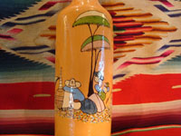 Mexican vintage pottery and ceramics, and Mexican vintage folk art, a pottery bottle from Tlaquepaque, Jalisco, c. 1930. The bottle has a lovely cream-colored background, with a wonderful scene of a snoozing Mexican campesino with his burro amidst wonderful trees and cacti. The artwork on this piece is exceptionally fine. Another view of the scene on this bottle.