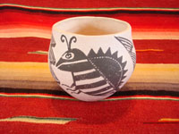 Native American Indian vintage pottery, a fine Acoma pot with an insect (bee or moth) motif, signed M. Antonio, c. 1960's. The insect motif is repeated three times, separated each time by the cloud/rain motif. Main photo of the Acoma pot by M. Antonio.
