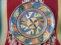 Mexican vintage pottery and ceramics, a wonderful petatillo (background with straw-like hatching) plate from Tlaquepaque, c. 1930-40. The plate has a very unique and early geometric and floral design. Main photo of the plate.