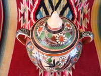 Mexican vintage pottery and ceramics, a lovely petatillo (background with straw-like hatchwork design) lidded jar, signed by the artist Jose Bernabe, on the bottom, c. 1960's. Photo shot from above the top of the lidded jar.