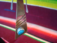 Native American Indian vintage silver jewelry, and Navajo silver jewelry, a lovely pair of dangling Navajo silver earrings with beautiful turquoise, c. 1950's. A closeup photo of the bottom of one Navajo silver earring, showing the lovely turquiose.