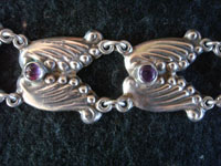 Mexican vintage sterling silver jewelry, and Taxco vintage silver jewelry, a stunning silver bracelet with beautiful amethyst cabochons, Taxco, c. 1930's. Closeup photo of the Taxco silver jewelry bracelet with amethyst cabochons.