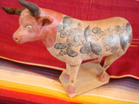 Mexican vintage pottery and ceramics, and vintage Mexican folk art, a wonderful burnished pottery bank in the form of a wonderful bull, with very detailed artwork on both sides, Tonala or Tlaquepaque, c. 1930's. Main photo of the burnished pottery bull from Tonala or Tlaquepaque.