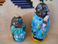 Mexican vintage folk art, and Mexican vintage pottery and ceramics, a pair of wonderful pottery bottles in the shapes of monkeys, with colorful decorations, Oaxaca, c. 1950's. A side view of the bottles.