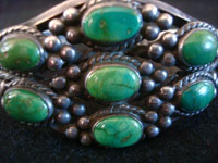 Native American vintage sterling silver jewelry, and Navajo sterling silver jewelry, a lovely Navajo silver bracelet with beautiful turquoise stones, very likely Cerillos, c. 1950's. A closeup photo of the turquoise on the front of the Navajo silver bracelet.