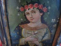 Mexican vintage devotional art, and Mexican vintage tinwork art, a lovely retablo depicting the Anima de Maria (Spirit of Mary, the Mother of God), painted on tin, c. 1930.  Closeup photo of Our Lady's face.