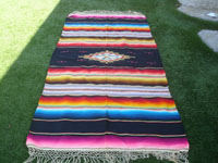 Mexican vintage textiles, and Mexican vintage Saltillo serapes (sarapes) and huipiles, a wonderful and very colorful Saltillo-style serape with a beautiful center medallion and embroidery between bands of color, c. 1940's.  Main photo of the serape.