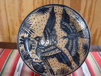 Mexican vintage pottery and ceramics, a beautiful pottery plate with a starry night background and lovely indigo blue glazing, and decorated with beautiful birds in flight, Tonala or San Pedro Tlaquepaque, c. 1930's. Main photo of the plate.