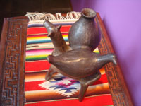 Mexican vintage folk art, a pottery cow with a bird and large water jar on its back, attributed to the great Heron Martinez, Acatlan, Puebla, c. 1950's. A photo of the back of the cow.