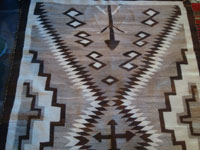 Native American vintage textiles, and Navajo vintage textiles and rugs, a J.B. Moore style rug with natural colored wool and a tight weave, Crystal, Arizona, c. 1930's or earlier.  Another view of a side of the rug.