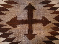 Native American vintage textiles, and Navajo vintage textiles and rugs, a J.B. Moore style rug with natural colored wool and a tight weave, Crystal, Arizona, c. 1930's or earlier.  A closeup photo of the cross in the center of the rug.