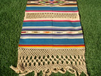 Mexican vintage textiles and Saltillo-style serapes (sarapes), a magnificent Saltillo-style serape runner, very finely woven and with lovely teneriffe (lacework) between the colorful bands of the textile, c. 1940's.  Closeup photo of one end of the serape.