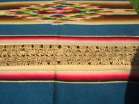 Mexican vintage textiles and Saltillo-style serapes (sarapes), a magnificent Saltillo-style serape runner, very finely woven and with lovely teneriffe (lacework) between the colorful bands of the textile, c. 1940's.  Closeup photo of the teneriffe lace-work in the serape.