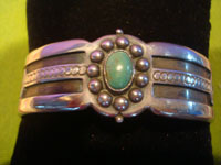 Mexican vintage sterling silver jewelry and Taxco vintage silver jewelry, a lovely Taxco silver bracelet with wonderful stamping and a beautiful turquoise stone, Taxco, c. 1940's. Main photo of the Taxco silver jewelry bracelet.