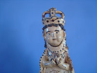 Mexican vintage devotional art, a lovely pottery statue of Our Lady of Good Health (Nuestra Senora de la Salud), patroness of the Lake Patzcuaro region, Tzintzuntzan, Michoacan, c. 1950's. Closeup photo of Our Lady's face.