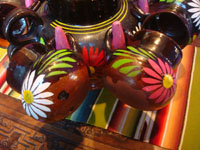 Mexican vintage pottery and ceramics, a lovely lidded pottery chocolate/champurada pot with six beautiful cups hanging from the sides, Michoacan, c. 1950's.  Closeup photo of the decorations.