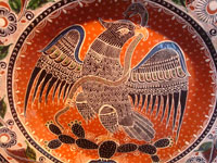 Mexican vintage pottery and ceramics, a very beautiful pottery charger with incredibly fine artwork featuring the Mexican eagle, Tonala or San Pedro Tlaquepaque, c. 1950's.  Closeup photo of the Mexican eagle on the front of the charger.