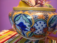 Mexican pottery and ceramics, a beautiful talavera pottery bowl with incredible glazing and artwork, Puebla, c. 1940's. A side view of another side of the talavera bowl.