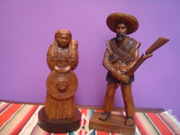 Mexican vintage woodcarvings and masks, a lovely woodcarving depicting a rvolutionary couple, Mexico, c. 1940's. Main photo of th couplle.