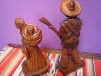 Mexican vintage woodcarvings and masks, a lovely woodcarving depicting a rvolutionary couple, Mexico, c. 1940's. Photo of the back side of the couple.