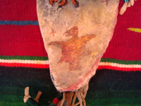 Native American Indian beadwork and folk art, a Plains knife-sheath with ghost-dance designs and symbolism, c. 1890-1910. The sheath is sinew sown with brain-tanned leather, and with fringe and bottom-tassles with beads. Closeup photo of the eagle painted on the front.