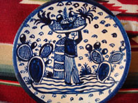Mexican vintage pottery and ceramics, two very beautiful plates with a white background and wonderful blue artwork decoration, Tlaquepaque, c. 1930-40's. Closeup photo of one of the plates, showing the pineapple vendor.
