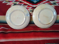 Mexican vintage pottery and ceramics, two very beautiful plates with a white background and wonderful blue artwork decoration, Tlaquepaque, c. 1930-40's. Photo of the back sides of the two Tlaquepaque pottery plates.