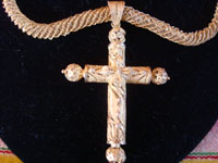 Mexican vintage gold jewelry, and Mexican antique devotional art, a truly stunning filagree gold cross on a finely woven gold chain, Mexico, early to mid-19th century. Closeup photo of the gold cross.