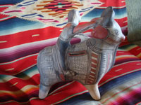 Mexican vintage folk art, and Mexican vintage pottery and ceramics, a wonderful pottery figure of a powerful bull with one happy rider, Guerrero, c. 1940's. A side view of the bull and rider from Guerrero.