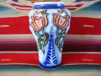 Mexican vintage pottery and ceramics, a beautiful Talavera urn or vase with rich royal blue and soft rose colored glaze decorations, Puebla, c. 1940's. Main photo of the Talavera urn or vase from Puebla.