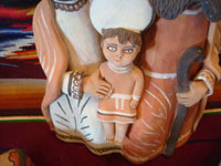 Peruvian pottery and ceramics, and Peruvian folk art, a wonderful pottery Nativity scene with lovely colors, Peru, c. 1970's. Closeup photo of the Baby Jesus.