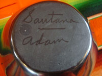 Native American Indian pottery and ceramics, a beautiful blackware pot with the San Ildefonso Pueblo feather design, signed on the bottom "Santana and Adam," San Ildefonso Pueblo, New Mexico, c. 1940-50's. Photo of the bottom of the jar or pot, showing the signatures of Santana and Adam.