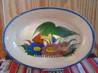 Mexican vintage pottery and ceramics, a wonderful oval charger with artwork featuring a lovely tropical bird, San Pedro Tlaquepaque, c. 1930's. Main photo of the charger.