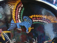 Mexican vintage pottery and ceramics, a beautiful blackware charger with a wonderful scene of a hunter aiming his rifle at a fierce eagle, as gazelles wander by, Tonala or San Pedro Tlaquepaque, c. 1940's. Closeup photo of the eagle.