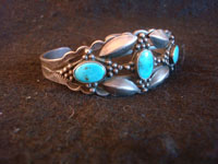 Native American vintage sterling silver jewelry, and Navajo sterling silver jewelry, a very beautiful silver bracelet with three wonderful turquoise stones, very possibly Blue Gem, and intricate stamping and silverwork, Navajo, Arizona or New Mexico, c. 1930's.  Main photo of the Navajo silver bracelet.