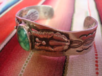 Native American Indian sterling silver jewelry, and Navajo vintage sterling silver jewelry, a beautiful Navajo silver bracelet with a lovely turquoise stone and with beautiful butterflies on either side, Arizona or New Mexico, c. 1950. Side view of the Navajo bracelet, showing the fine stamping.