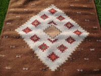 Mexican vintage textiles and sarapes, a very beautiful Zapotec textile with a fine weave and beautiful colors, Oaxaca, c. 1980. Closeup photo of the central diamond.