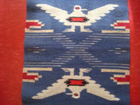 New Mexican Chimayo textile runner, c.1940. Quite striking with indigo yarn, and great pictorial Chimayo with two eagles, Northern New Mexico, c. 1940. Closeup photo of part of the textile showing an eagle.
