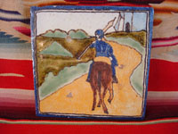 Mexican vintage pottery and ceramics, a talavera tile from Puebla, c. 1940's. The tile is hand-painted with a scene of Don Quixote, the Man of La Mancha, mounted on his horse and holding his lance. Main photo.