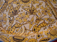 Mexican vintage pottery and ceramics, a beautiful fantasia-ware (fantasia) platter with highly imaginative decoration, Tlaquepaque, Jalisco, c. 1920-30's. Closeup photo of some of the artwork on the front of the fantasia platter.