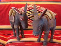 Mexican vintage folk-art and Mexican vintage wood-carving, a wonderful pair of wood-carved and hand-painted burros, complete with painted saddles and horse-hair (or burro-hair) tails, c. 1930.  Main photo of the Mexican wood-carved burros.