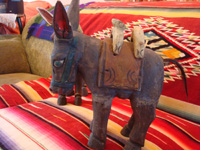 Mexican vintage folk-art and Mexican vintage wood-carving, a wonderful pair of wood-carved and hand-painted burros, complete with painted saddles and horse-hair (or burro-hair) tails, c. 1930.  Another view of the side of one of the wood-carved burros.