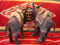 Mexican vintage folk-art and Mexican vintage wood-carving, a wonderful pair of wood-carved and hand-painted burros, complete with painted saddles and horse-hair (or burro-hair) tails, c. 1930.  A photo showing the rear ends of the two wood-carved, folk-art burros.