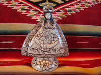 Mexican pottery and ceramics, and Mexican devotional art, a pottery statue of Our Lady of Good Health, from Tzintzuntzan, Michoacan, c. 1980. The piece is in the traditional style of Tzintzuntzan, with a cream-colored background glaze and black (dark-brown) designs. Main photo.