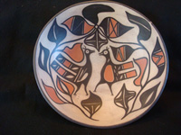 Native American Indian pottery and ceramics, a medium/large dough bowl from Santo Domingo Pueblo, c. 1970-80. The designs painted on the bowl are very beautiful and feature wonderful birds and foliage. Main photo of the Indian pottery bowl.
