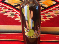 Mexican vintage pottery and ceramics, a beautiful black-ware bottle with exquisite artwork, Tlaquepaque, Jalisco, c. 1930's. Another photo showing the artwork on the sides of the Talquepaque bottle.